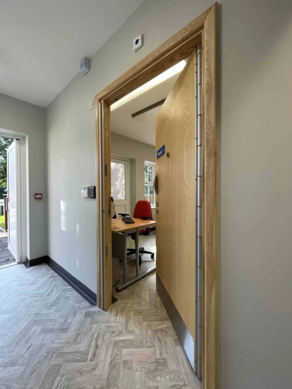 Door to entrance open and door to group room open from corridor